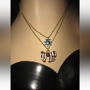 Betsey Johnson Gold Necklace with Blue and Red Bow Pendant